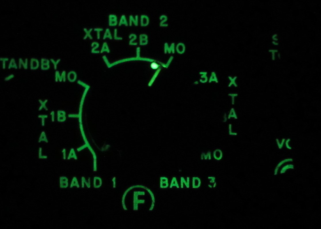 The GRC-9 uses phosphorescent paint on the panel and knobs.  It is not radioactive.